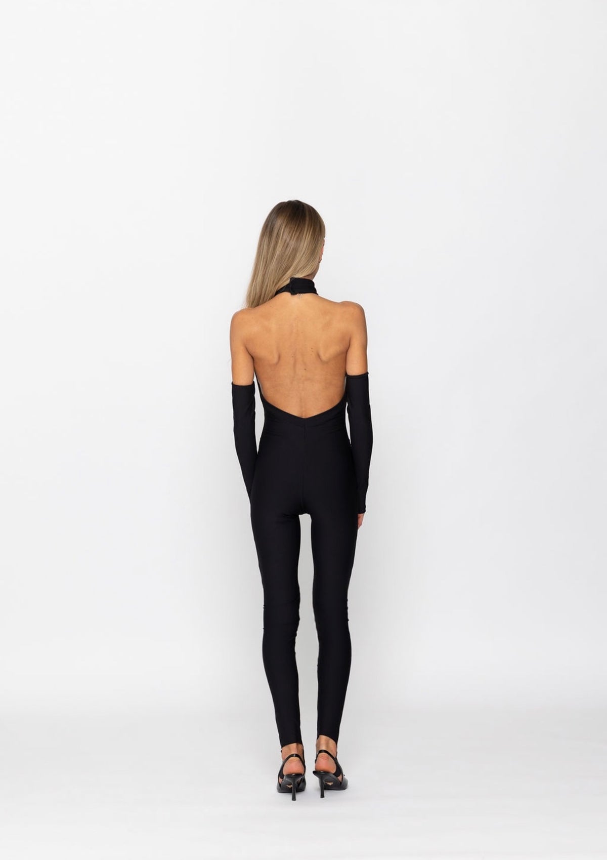 NOIRÉ – Open Back Jumpsuit